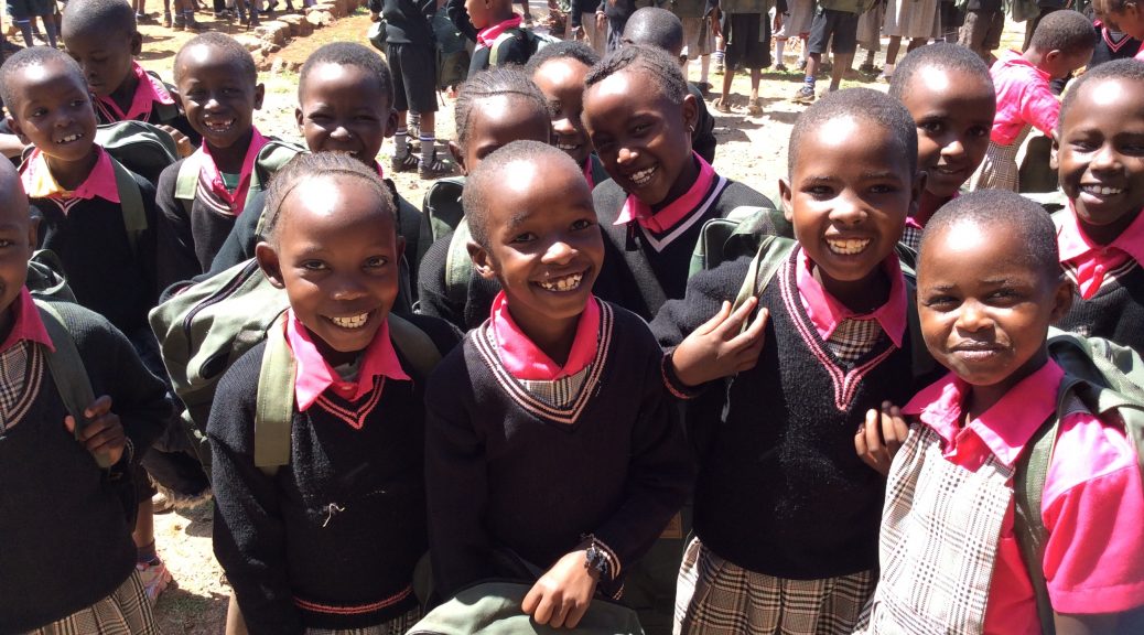 200 happy children with their new backpacks.