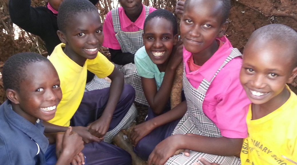 Girls in their mud hut