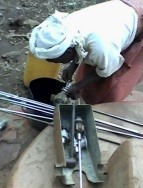 The women caretaker being trained in how to replace pump seals.