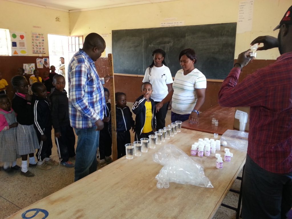 Children lining up to take their Trachoma medicine